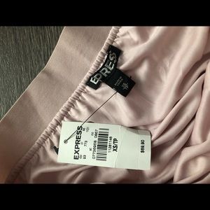 Pleated pink midi skirt